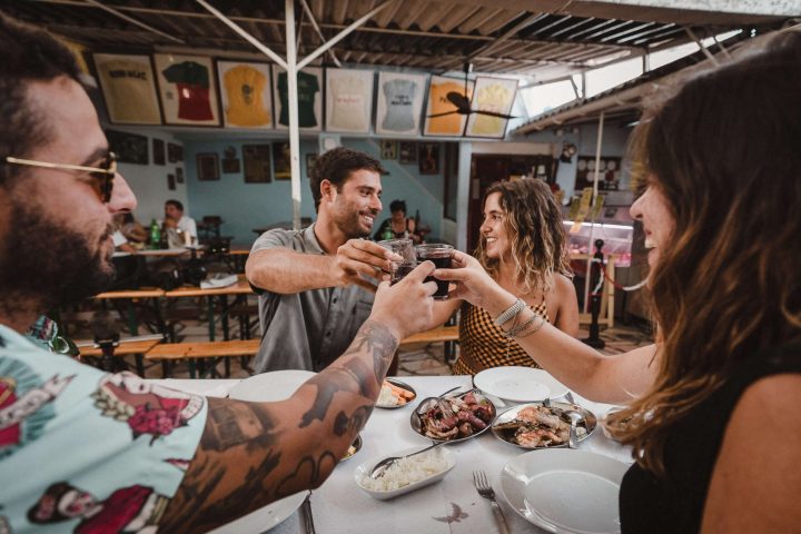 a man and a woman sitting on a table