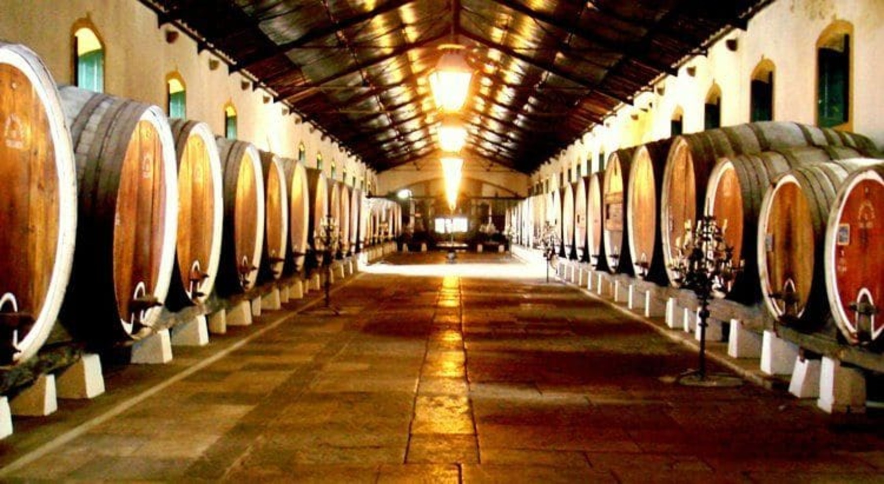 a row of wooden benches sitting on top of a barrel