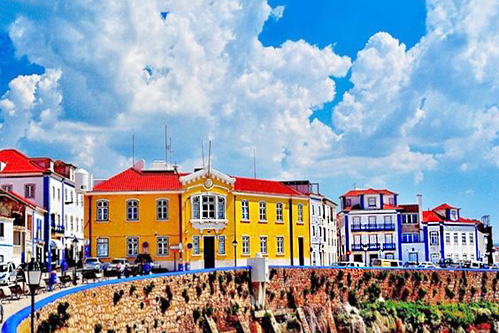a group of people flying kites in a building