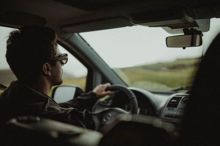 a man sitting in a car