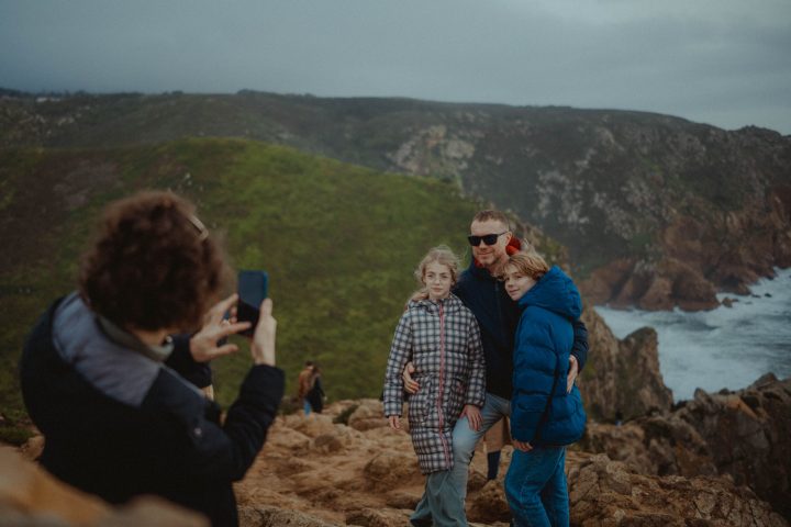 a group of people standing on top of a mountain