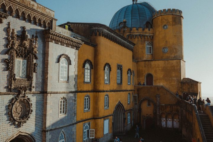a group of people standing in front of a building