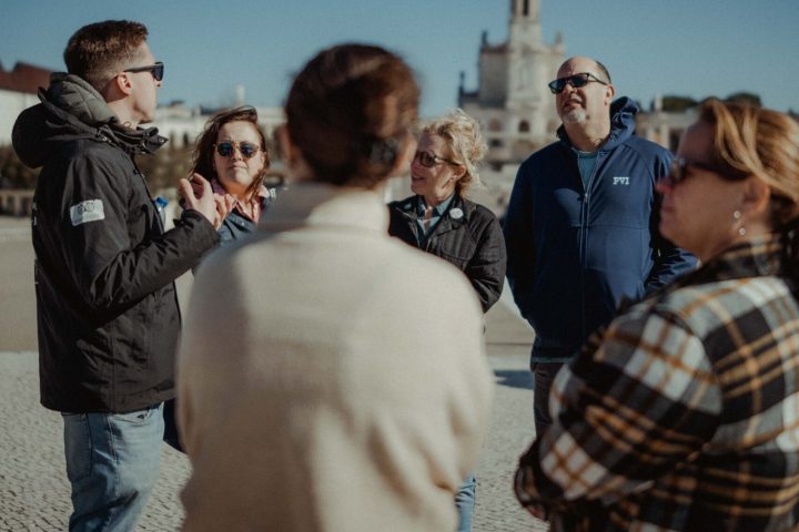 a group of people standing in front of a crowd