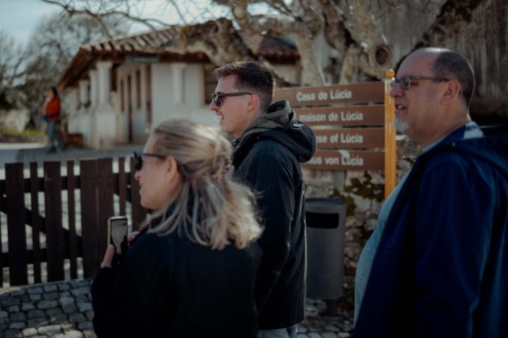 a man and a woman standing in front of a building