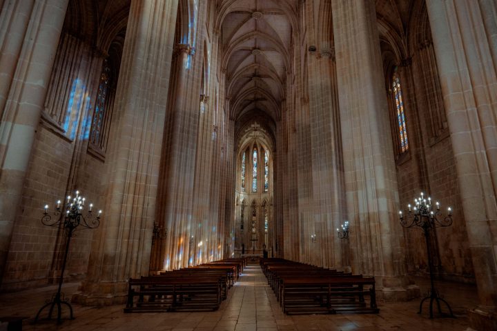 a room that has a clock at the top of a wooden chair