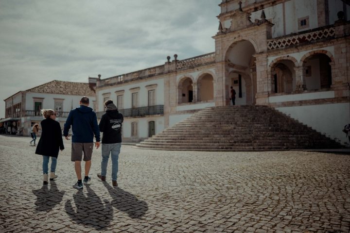 a man standing in front of a building