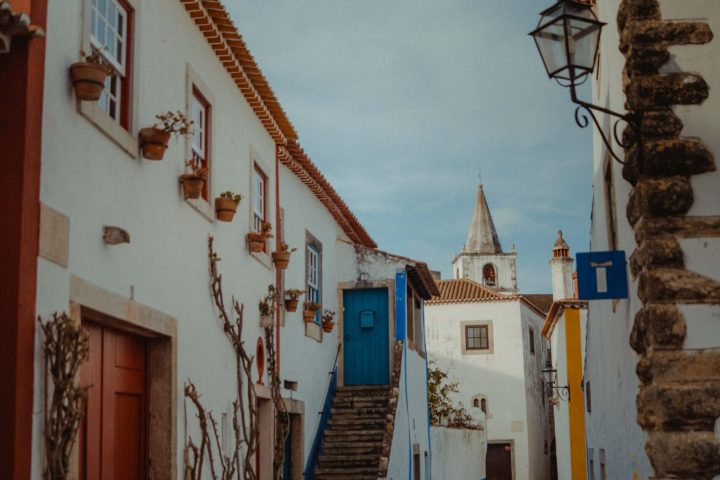 a house that has a sign on the side of a building
