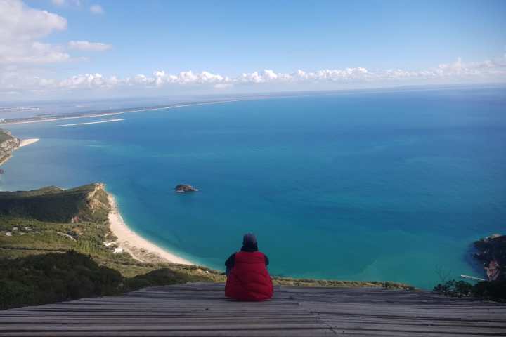 a view of a body of water with a mountain in the background