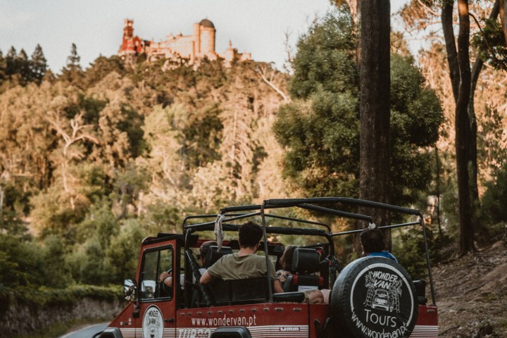 a truck driving down a dirt road