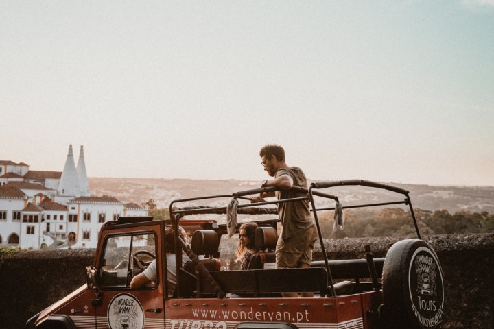 a man riding on the back of a truck