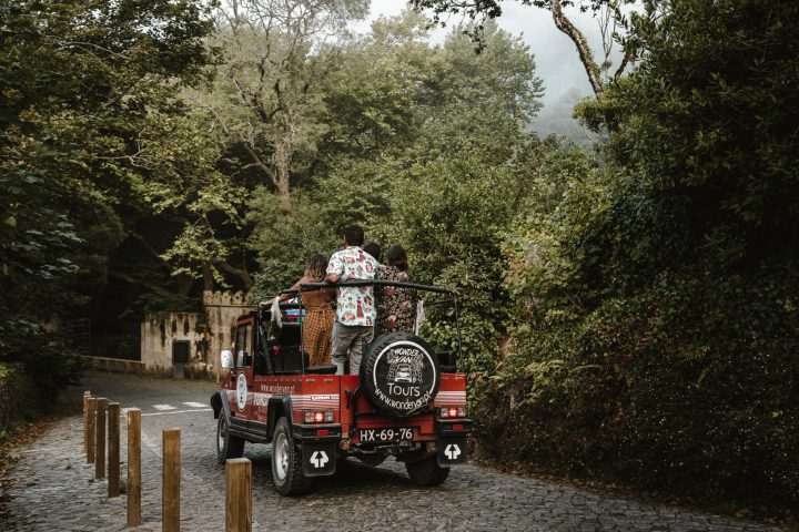 a fire truck driving down a dirt road