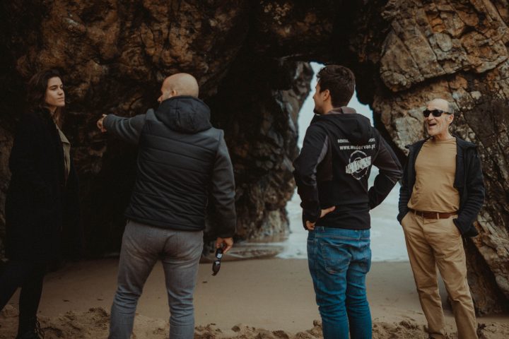 a group of people standing around each other