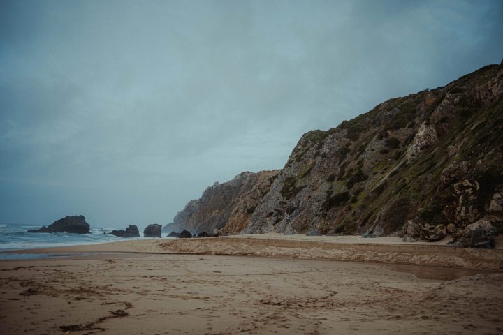 a beach with a mountain in the background