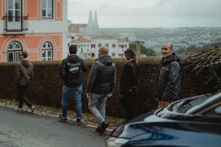 a group of people standing in front of a building
