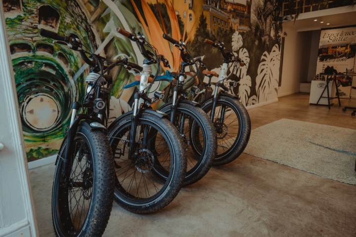 a bicycle parked on the side of a building