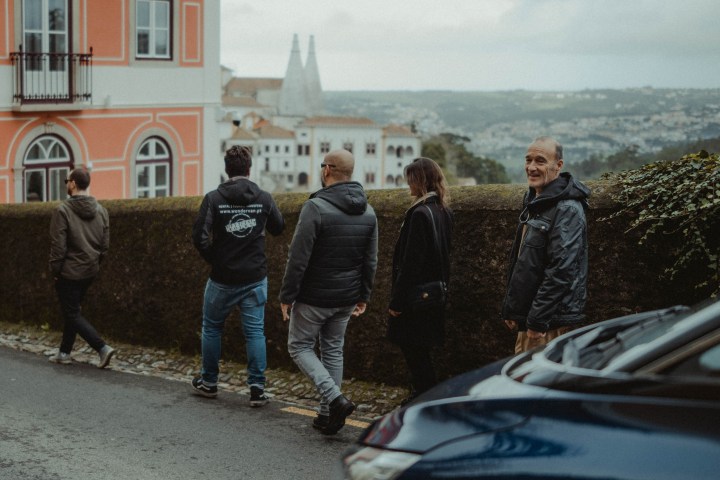 a group of people standing in front of a building