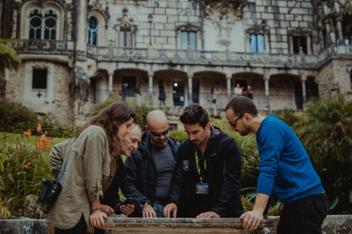 a group of people standing in front of a building