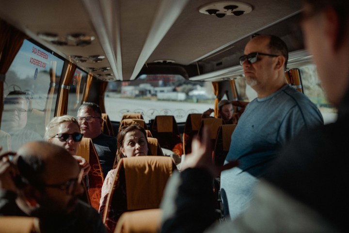 a man standing in front of a crowd of people