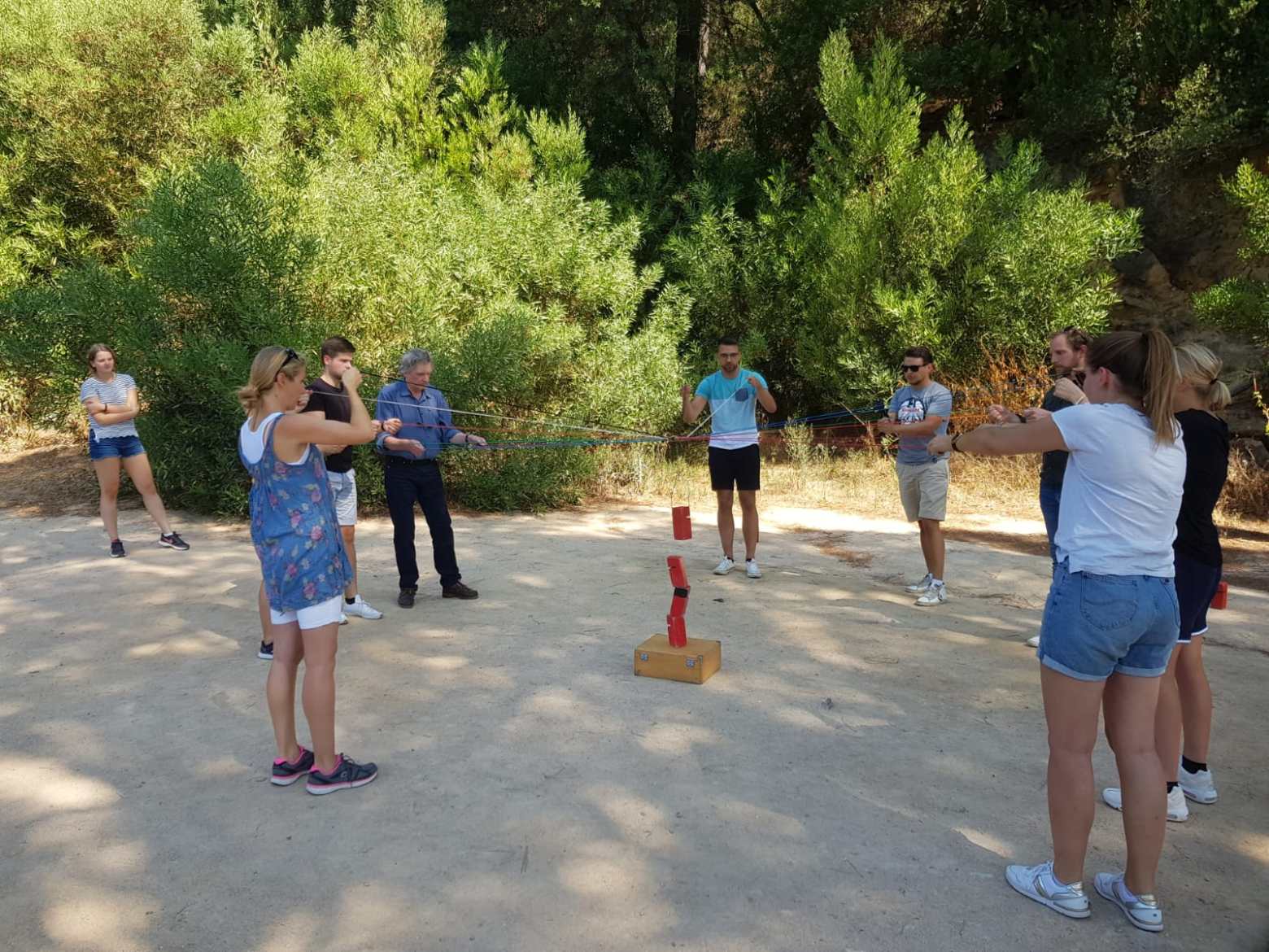 a group of people standing in a parking lot