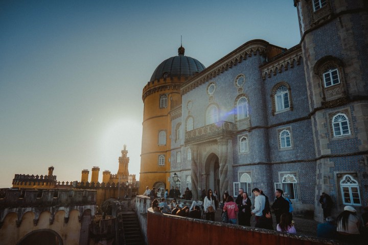 a group of people standing in front of a building