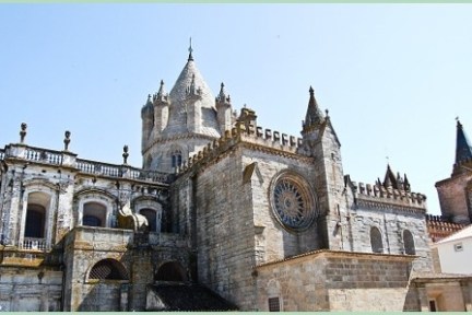 a church with a clock on the front of a building