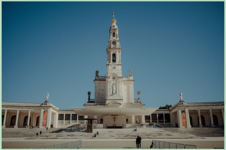 a large clock tower in front of a building